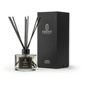 Reed diffuser with black sticks and a black box labeled 'Essence of Peace' on a white background